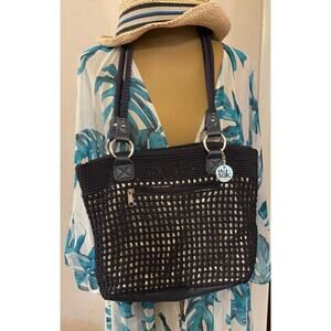 The Sak navy weaved purse with metallic